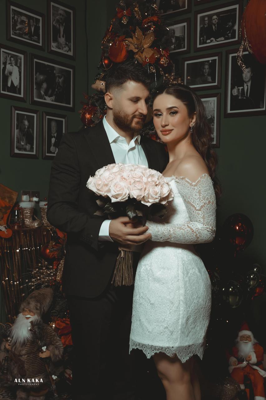 Nuhayl and Helen holding flowers