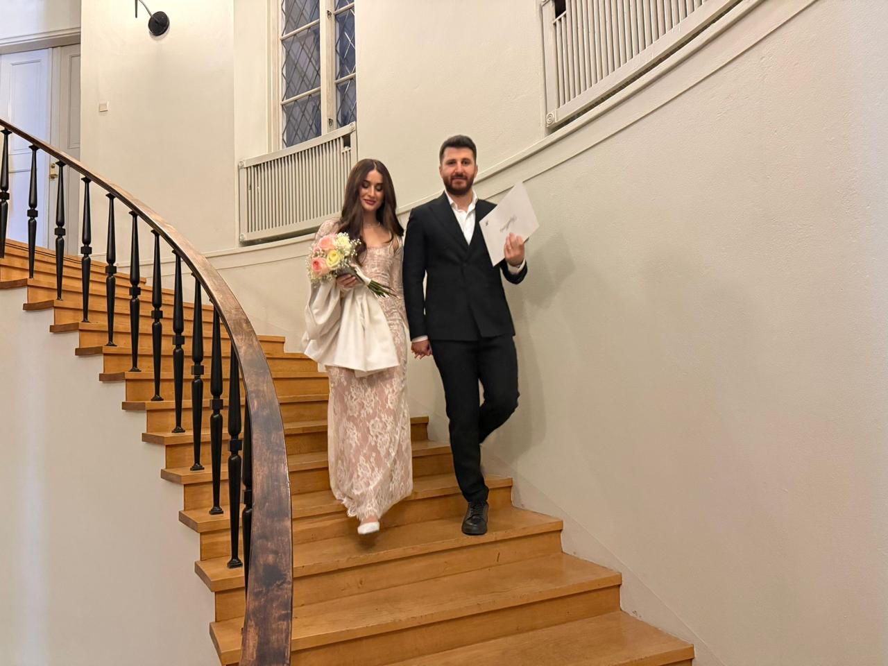 Nuhayl and Helen walking down a staircase